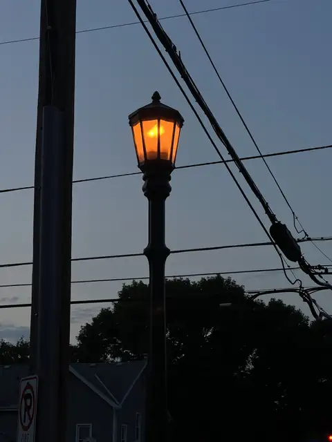 Golden light cuts through the twilight blue.
